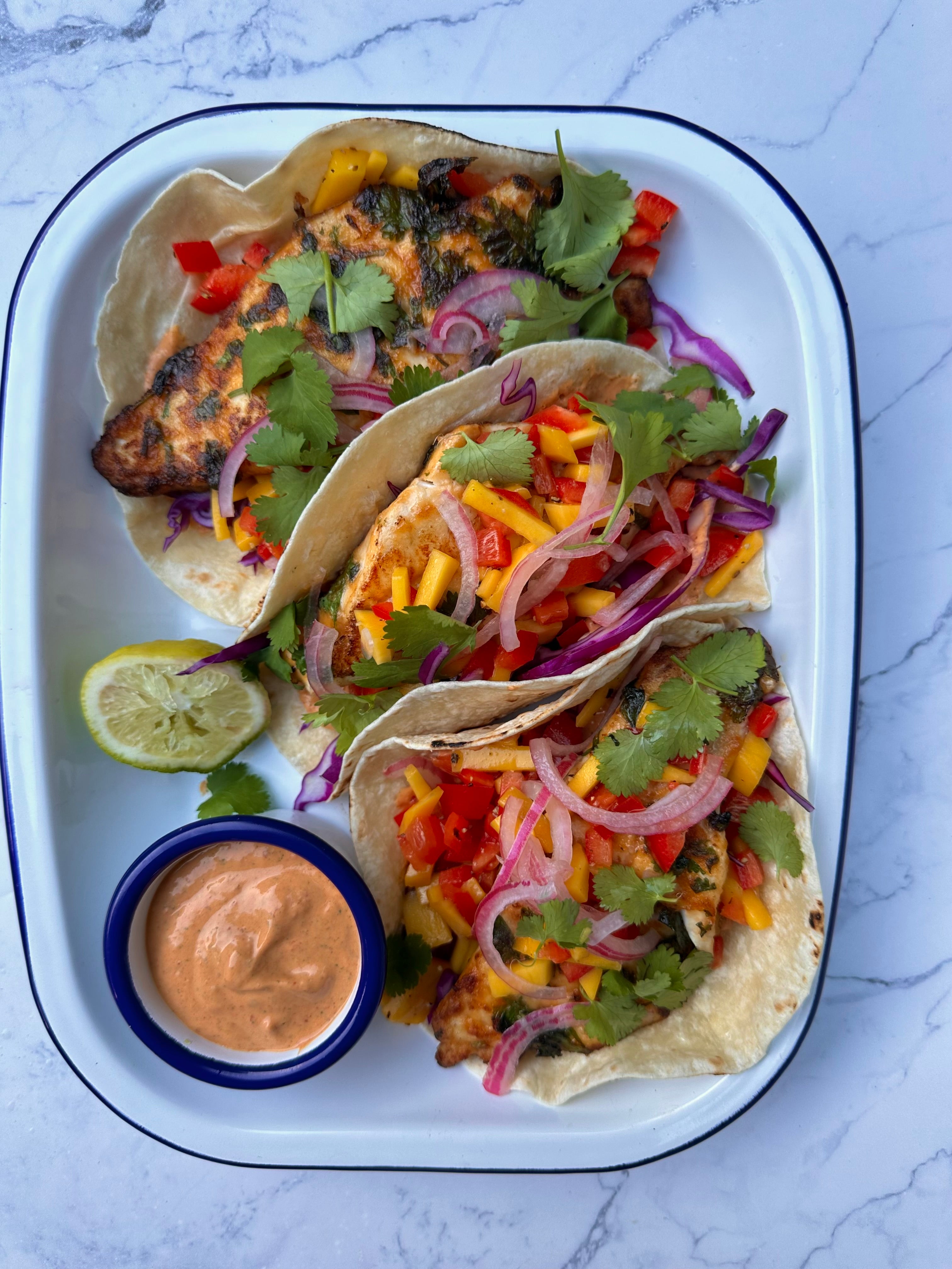 Hitole Fish Chipotle fish tacos with a creamy chipotle sauce and mango salsa – Miss ...